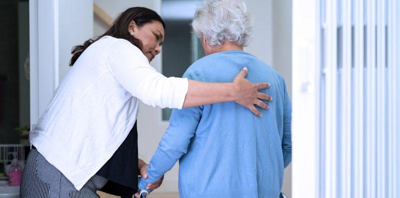 Woman assisting an elderly woman