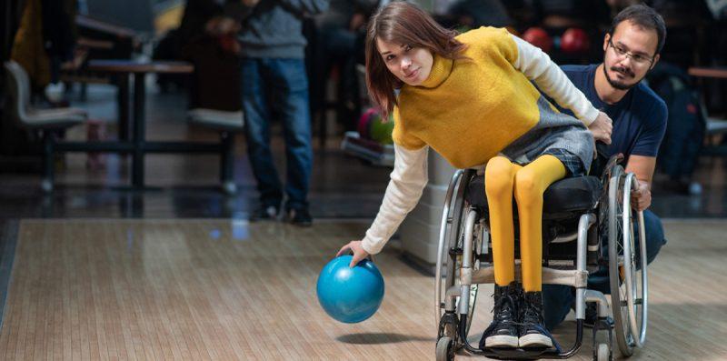 Woman in a wheelchair bowling